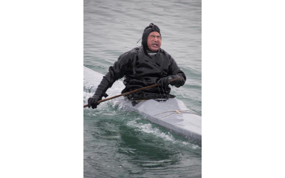 Outdlaq Qujaukitsoq comes up for air while demonstrating how to roll his kayak. A group of Inuit locals demonstrated local culture and provided food in front of a small but appreciative and apprehensive crowd watching from the Thule Air Base main pier.