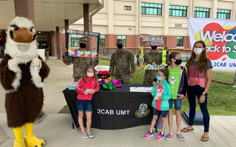 Army chaplains from the unit ministry team at Camp Humphreys, South Korea, welcome Camp Humphreys Central Elementary School students back to class on Monday, Aug. 23, 2021. 