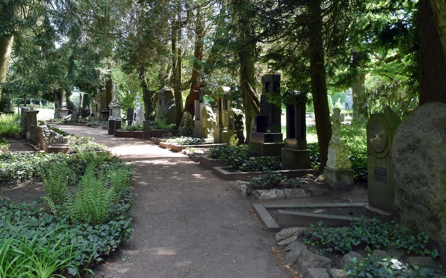 A cemetery in a park with 19th century graves.