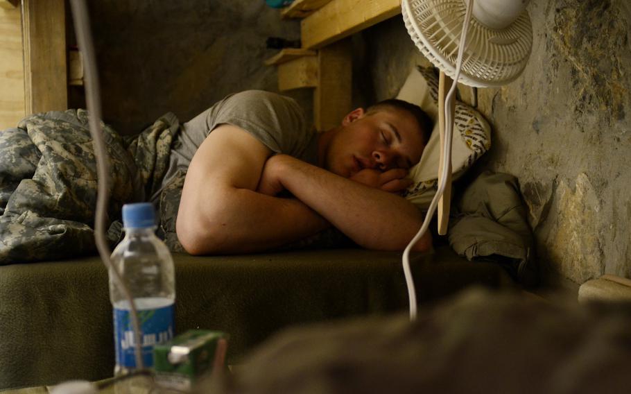 Pfc. Jacob Lunceford with the 1st Battalion, 501st Infantry Regiment sleeps in his barracks at Combat Outpost Sabari, Khost province.