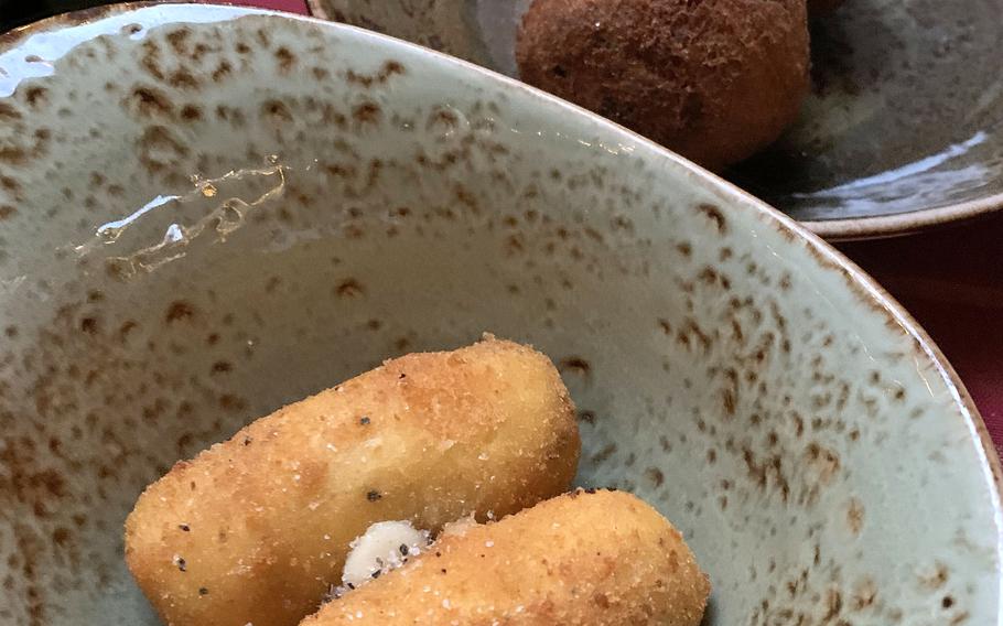 Appetizers at Buatta include potato croquettes with cheese and lemon, and eggplant meatballs. The Naples, Italy, restaurant opened in 2012 with a focus on homestyle cooking.