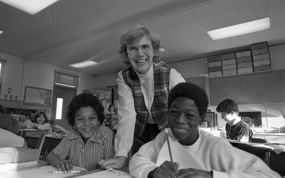 Fourth grade teacher Kathryn Willers with J.T. Williams III, 9, (left) and Derek Dixon, 9, in the classroom.