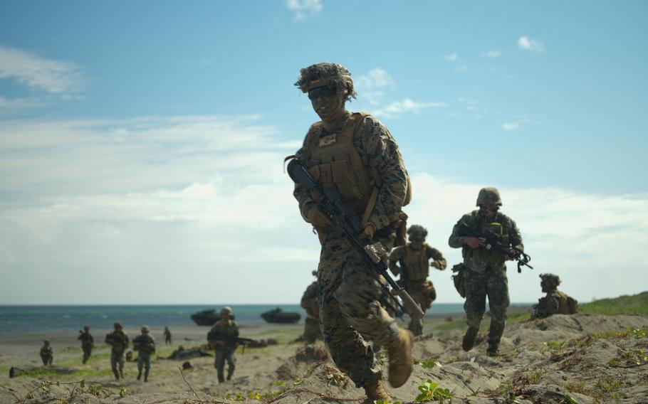 U.S. and Philippine Marines take part in a bilateral amphibious landing in Claveria, Philippines, March 31, 2022, during the annual Balikatan exercise. 