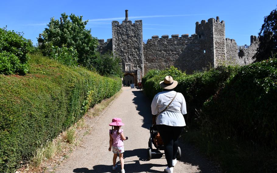 Visitors walk to the main gate of Framlingham Castle in July 2022. The castle has had many owners since its construction in the12th century. But in 1553 was owned by Mary Tudor, the first queen regnant of England. 