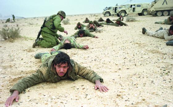 Somewhere in Iraq, Feb. 1991: Iraqi prisoners of war are checked after their surrender to American troops from Iron Troop, 2nd Armored Cavalry Regiment.

Looking for Stars and Stripes’ Gulf War coverage? Subscribe to Stars and Stripes’ historic newspaper archive! We have digitized our 1948-1999 European and Pacific editions, as well as several of our WWII editions and made them available online through https://starsandstripes.newspaperarchive.com/

META TAGS: Gulf War; Iraq; U.S. Army; POW; combat; 