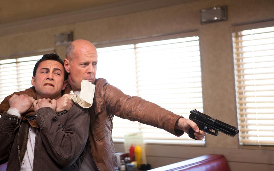 Joseph Gordon-Levitt and Bruce Willis are pictured in the 2012 action thriller “Looper.”