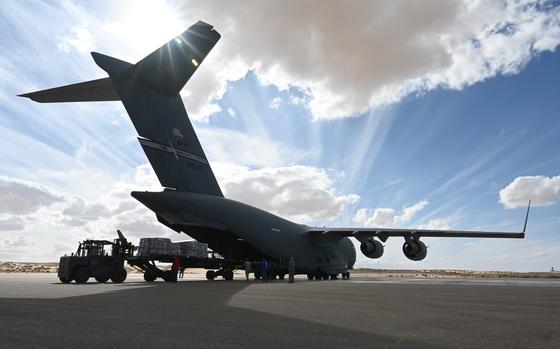 An Air Force C-17 is loaded with humanitarian aid from the U.S. Agency for International Development for transport to the Middle East on Nov. 28, 2023.