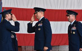 Maj. Gen. Paul Moga, 3rd Air Force commander,  and Cols. Kevin Crofton and William Lutmer, from left, stand at attention during the 52nd Fighter Wing change-of-command ceremony at Spangdahlem Air Base, Germany, on June 30, 2025. Lutmer took over command of the wing from Crofton, who led Spangdahlem for the past two years.
