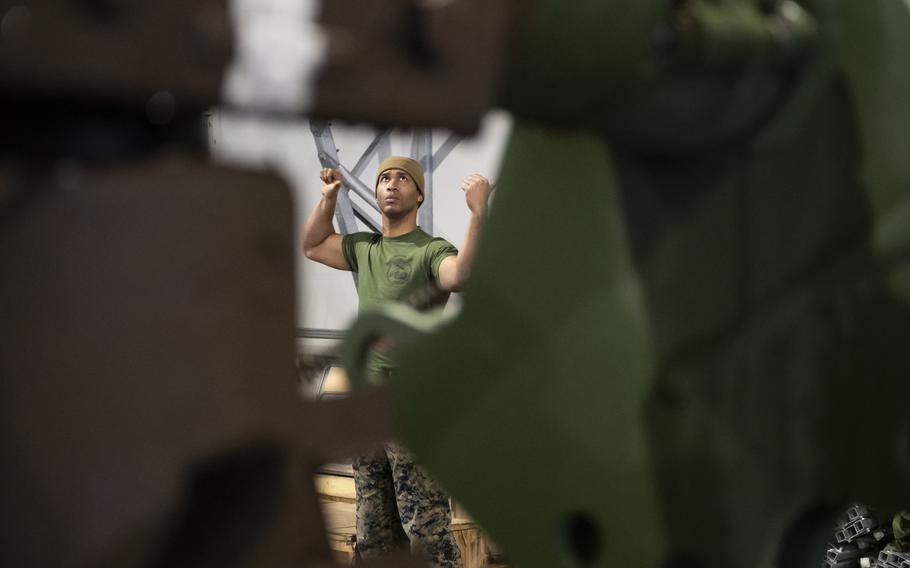 Lance Cpl. Adrian Bates, a motor transport operator with Combat Logistics Detachment, 3rd Battalion, 6th Marine Regiment, works at Setermoen Military Camp, Norway, on Saturday, March 19, 2022, ahead of an upcoming training exercise.