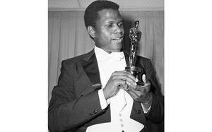 FILE - Actor Sidney Poitier poses with his Oscar for best actor for "Lillies of the Field" at the 36th Annual Academy Awards in Santa Monica, Calif. on April 13, 1964.  Poitier, the groundbreaking actor and enduring inspiration who transformed how Black people were portrayed on screen, became the first Black actor to win an Academy Award for best lead performance and the first to be a top box-office draw, died Thursday, Jan. 6, 2022 in the Bahamas. He was 94. (AP Photo, File)