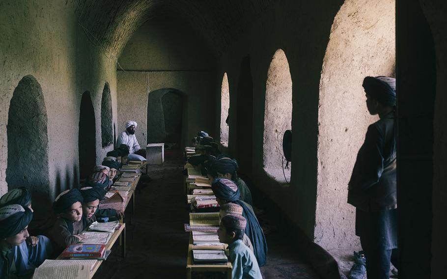 Students read the Quran in a madrassa in Musa Qala, on June 16, 2022.