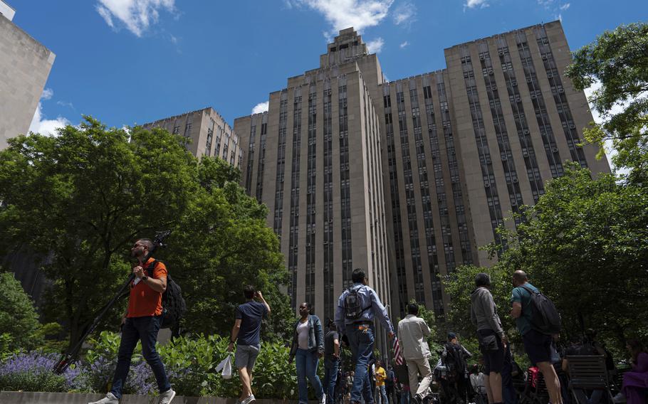 People walk by the Manhattan Criminal Court building, Wednesday, May 29, 2024, in New York. 