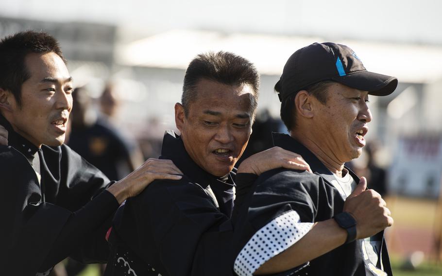 Japanese troops of the Maritime Self-Defense Force compete with U.S. sailors and Marines on Sports Day at Marine Corps Air Station Iwakuni, Japan, on Oct. 28, 2022.