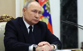 Russian President Vladimir Putin listens to Russian Transport Minister Vitaly Savelyev during their meeting in Moscow, Russia, Saturday, March 25, 2023. (Gavriil Grigorov, Sputnik, Kremlin Pool Photo via AP)