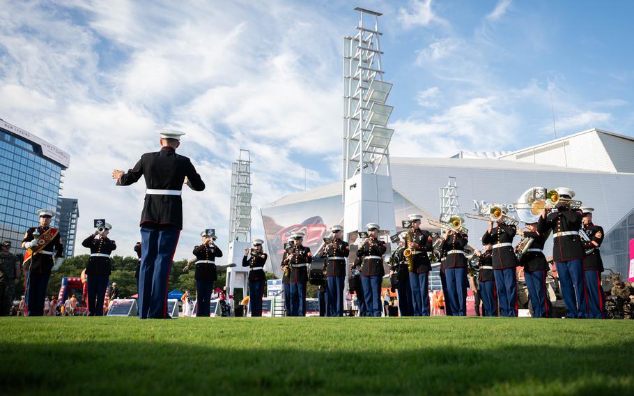 A Marine band plays.