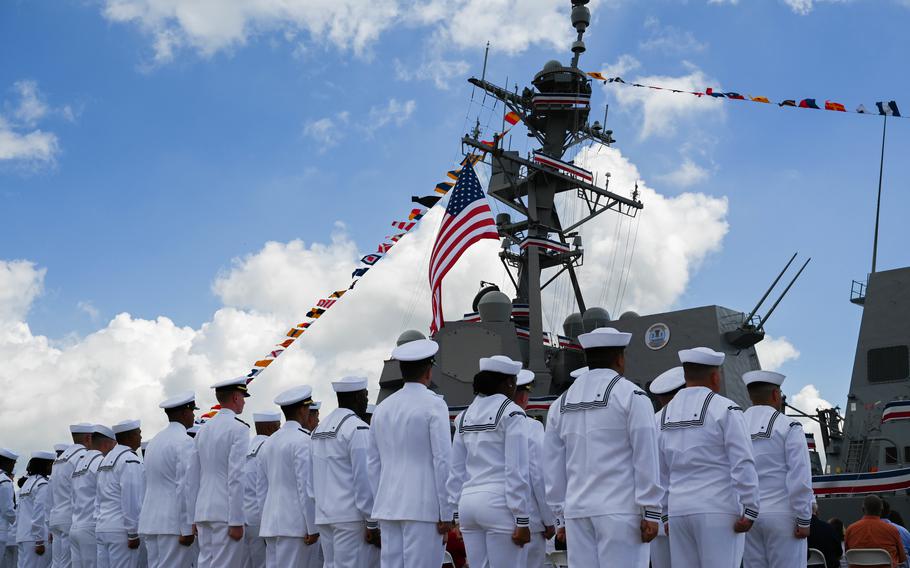 U.S. Navy sailors stand at attention during the commissioning of the USS Frank E. Petersen Jr. in Charleston, S.C., May 14, 2022.