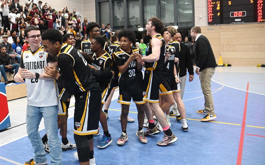 The Stuttgart Panthers celebrate their Division I title after defeating Ramstein 62-60 in double overtime in the Division I championship game at the DODEA-Europe basketball championships in Ramstein, Germany, Feb. 18, 2023. 