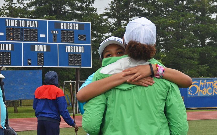 Yokota High School student Daisy Elliott embraces here mother, Cynthia Elliott, during the Kanto Plains Special Olympics at Yokota Air Base, Japan, Saturday, May 22, 2021. 