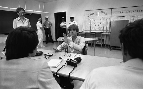 Hed: Jedi visits Nile C. Kinnick High School, 1978

Yokosuka, Japan, June 16, 1978: Mark Hamill, better known to many as young Jedi Luke Skywalker of Star Wars fame, seems to be telling students, staff and reporters at an assembly at the Teen Club at Nile C. Kinnick High School that these are not the droids they're looking for. 
Hamill - in Japan on a publicity junket for the July 1st opening of "Star Wars" in Tokyo and Osaka - took a sentimental detour to his old alma mater which he attended as a military brat when his father - a Navy Exchange officer - was stationed at Yokosuka. He told the gathered crowd how he and several other seniors violated curfew on prom night and wound up in Shore Patrol headquarters - in tuxedos and formals.

Read the story and see more photos of Hamill's Yokosuka visit here:  https://www.stripes.com/history/2023-05-04/'star-wars'-star-mark-hamill-visits-yokosuka-alma-mater-1819361.html

Want to read Stars and Stripes’ interviews with other celebrities in Europe and the Pacific? Subscribe to Stars and Stripes’ historic newspaper archive! We have digitized our 1948-1999 European and Pacific editions, as well as several of our WWII editions and made them available online through https://starsandstripes.newspaperarchive.com/

META TAGS:  celebrity; entertainment; movies; military community; military brat; military family; Star Wars; Luke Skywalker; DODDS; Department of Defense Dependent Schools; science fiction; sci-fi; celebrity