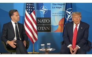 NATO Secretary-General Mark Rutte listens to President Donald talk with NATO backdrop.