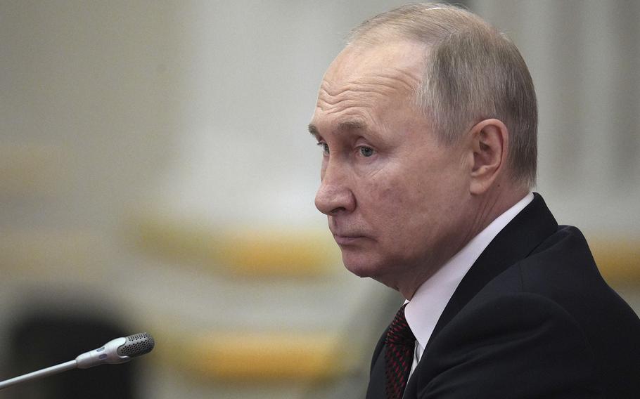 Russian President Vladimir Putin attends a meeting in St. Petersburg, Russia, on Dec. 26, 2022. 