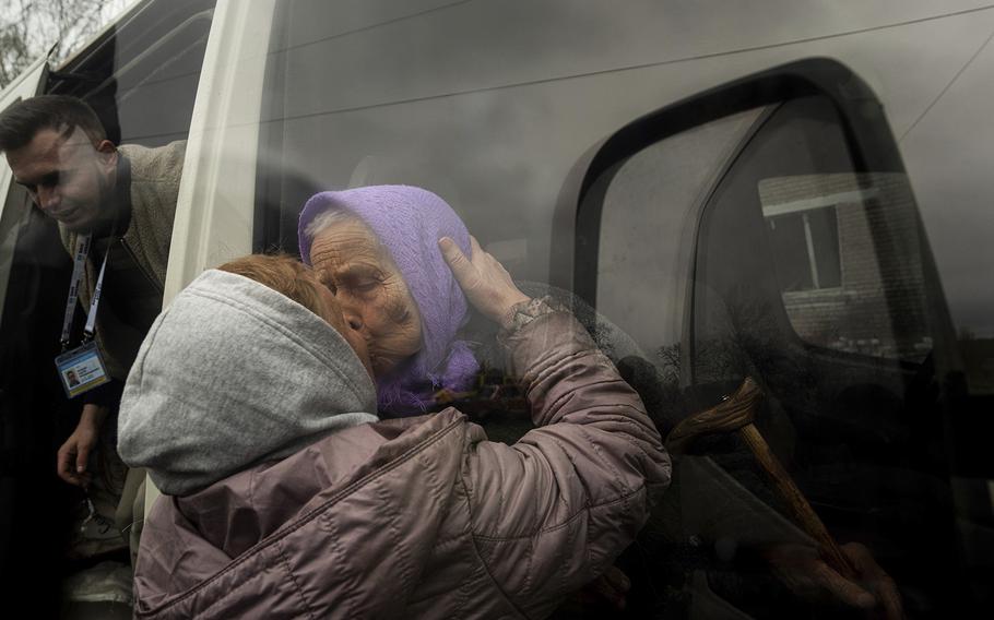 Olha Faichuk, 79, kisses her neighbor as she is evacuated from her home, which was heavily damaged by a Russian airstrike in Lukiantsi, Kharkiv region, Ukraine, on April 16, 2024. 