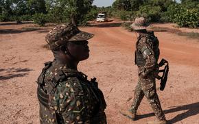 Members of the Ghana Immigration Service patrol their country’s porous border with Burkina Faso, inspecting cars crossing in Gwollu, Ghana. MUST CREDIT: Guy Peterson/For The Washington Post