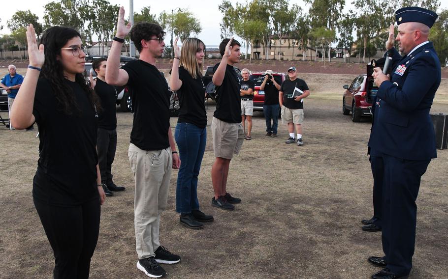 U.S. Space Force recruits recite the Oath of Enlistment to Maj. Mark Lazane, 362nd Recruiting Command Squadron recruiting operations director, during a total force enlistment ceremony at the Astronomy Association of Arizona Lunar Eclipse event May 15, 2022, in Buckeye, Arizona. After Basic Military Training, the recruits will become U.S. Space Force Guardians, and will help to enhance the way  joint and coalition partners conduct global space operations.