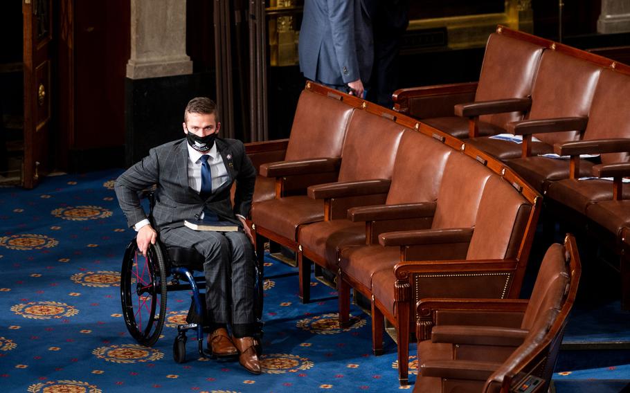 Rep. Madison Cawthorn, R-N.C., arrives on the House floor in the Capitol in Washington, D.C., before being sworn in on Jan. 3, 2021. 