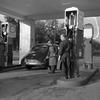 Hed: Gas rationing, 1948

Berlin, Germany, Sep. 21, 1948: An American gets his monthly ration of five gallons at the one service station in Berlin still serving privately-owned vehicles. 

The image is one of a series of 9 shot Sep. 21, 1948 by Stars and Stripes photographer Gerald Waller titled "Berlin Americans live normal life," to show how Americans were adapting living in Berlin during the Berlin Blockade which began June 24, 1948 when Soviet leader Josef Stalin imposed the blockade, cutting off all land and river transit between West Berlin and West Germany. In response, Western Allies initiated a massive airlift to get supplies into beleaguered Berlin. 

The original negative that this image was captured on suffers from a preservation issue called “silvering,” where the silver particles rise to the top of the gelatin layer of the film — you can see evidence of it in the form of the "lightning bolt" hitting the far right gas pump. 
During a preservation survey of Stripes’ photo collection in 2018, archives staff found that especially the 4x5 negatives from the late 1940s and early 1950s were suffering the most from this preservation issue. As the “silvering” will eventually cause the image captured on the negative to fade, the affected negatives were pulled and prioritized for scanning.

Read Waller's article and see additional photos here.

https://www.stripes.com/history/2025-05-09/stars-stripes-archive-yanks-in-berlin-normal-lives-1948-17701040.html

Looking for Stars and Stripes’ historic coverage? Subscribe to Stars and Stripes’ historic newspaper archive! We have digitized our 1948-1999 European and Pacific editions, as well as several of our WWII editions and made them available online through https://starsandstripes.newspaperarchive.com/

META TAGS: post-war Germany; Berlin; Berlin Blockade; Cold War; Berlin airlift; dependents; military life; military family; West Berlin; American sector