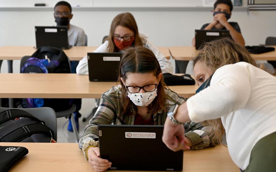 Eighth-grade English teacher Sara Pogue helps Edie Rittle during class at Nitschmann Middle School in Bethlehem, Pa. 