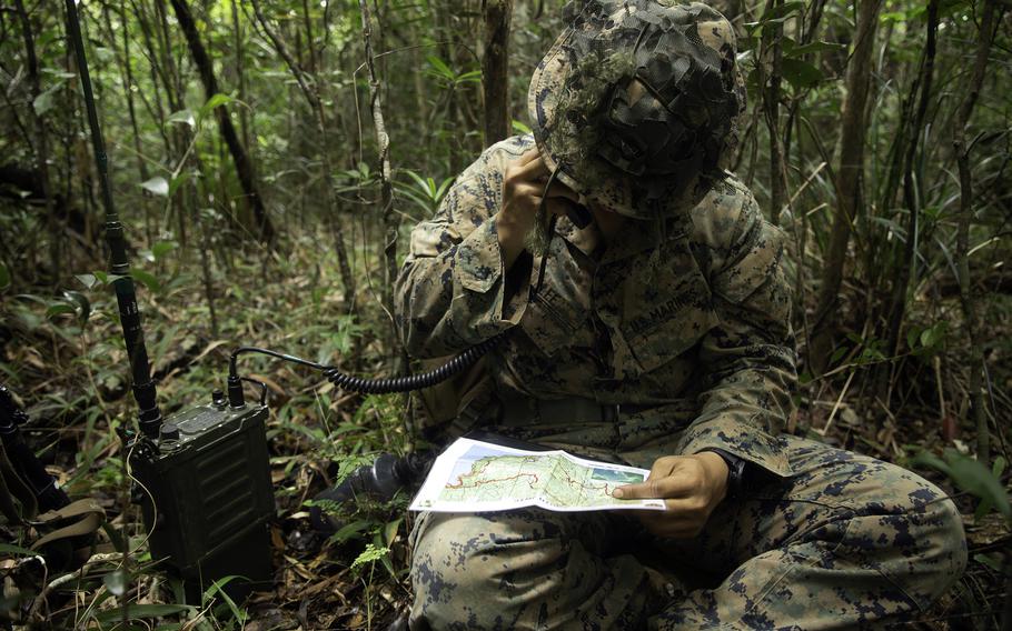 1st Lt. Eunwon Lee, the fire support team leader with 3rd Battalion, 3rd Marine Regiment, calls for fire support during a jungle warfare exercise at Okinawa’s Northern Training Area, May 26, 2021.