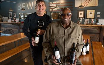 Local baseball great Dusty Baker, the manager for the Houston Astros — and former manager of the San Francisco Giants — who started his baseball career at Del Campo High School in Fair Oaks, Calif., sits with winemaker Chil Brenneman inside of the tasting room at the Baker Wine Family in West Sacramento, Calif., Dec. 10, 2021. 