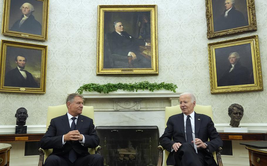 President Joe Biden meets with Romania’s President Klaus Iohannis in the Oval Office of the White House, Tuesday, May 7, 2024, in Washington.