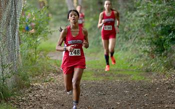 Kaiserslautern runner Samantha Ramsey leads a pair of teammates, including Alexandra Beck, right, during a meet at Ramstein High School on Sept. 30, 2023, on Ramstein Air Base, Germany.