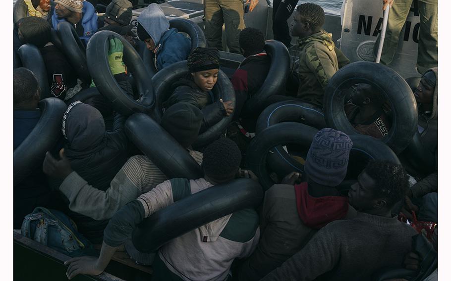 Migrants are transported by the Tunisian coast guard after their boat was intercepted near Sfax, Tunisia, on May 27, 2023. 