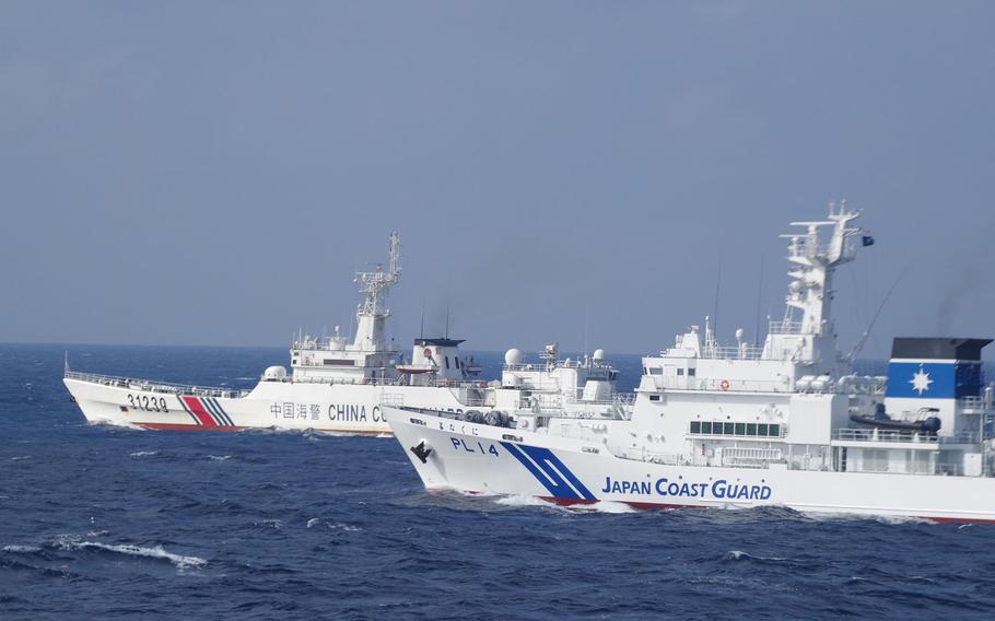 The Japan Coast Guard responds to a Chinese vessel near the Senkaku Islands in the East China Sea, in this undated photo. 