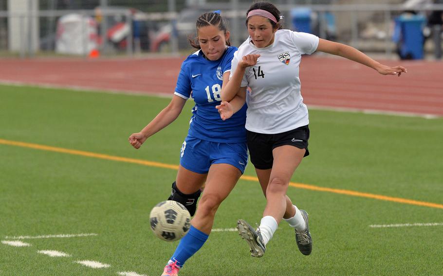Stuttgart’s Sienna Ingle centers the ball in front of a defending Nailya McLeish at the DODEA-Europe soccer championships in Ramstein, Germany, May 22, 2025. Ramstein won the Division I title game 3-1.