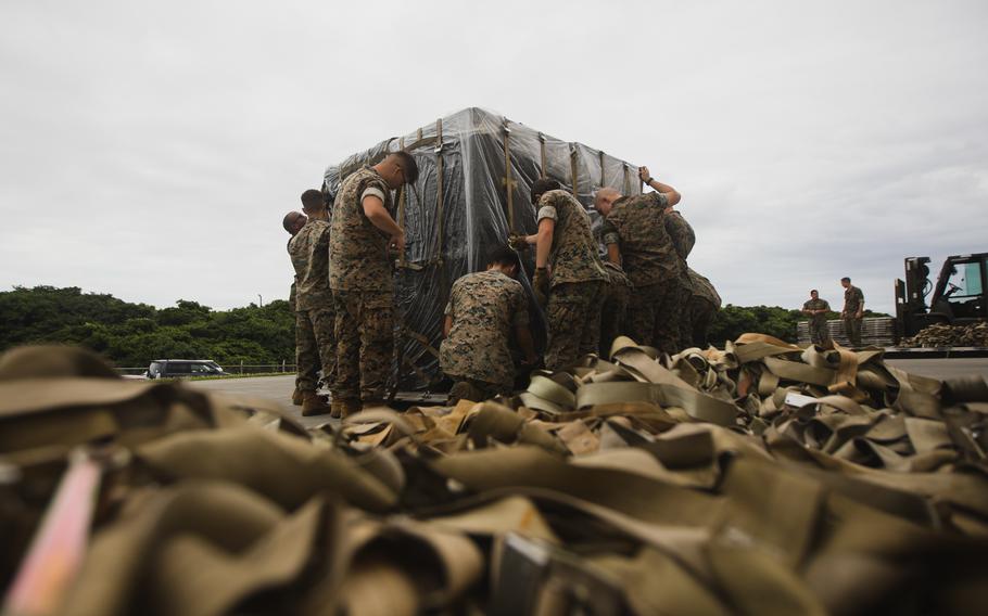 Marines with III Marine Expeditionary Force prepare pallets of body armor, individual first-aid kits, and other nonlethal equipment essential to Ukraine’s front-line defenders for transport at Kadena Air Base, Okinawa, Japan, on May 6, 2022.
