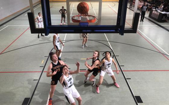 Players from Bahrain and Spangdahlem battle for a rebound in the opening game of the DODEA-Europe Division III girls basketball tournament Wednesday, Feb. 15, 2023.