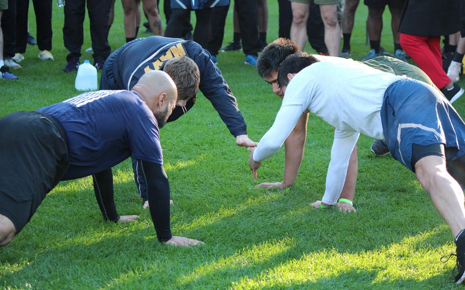 The final four contestants in compete in the Wheel of Death during a Base HIIT physical training session for service members at Nationals Park in Washington, D.C., on Oct. 24, 2023. James Kovacs, from the Navy, won the competition and took home tickets to see a Washington Nationals game from the luxurious Terra Club.