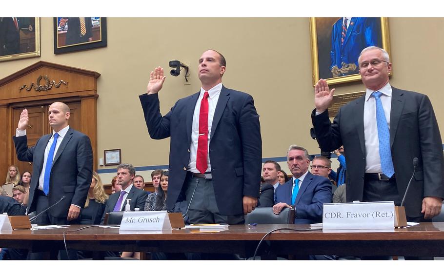 Ryan Graves, a former Navy F-18 pilot, David Grusch, a former intelligence officer with the Air Force, and retired Navy Cmdr. David Fravor are sworn in Wednesday, July 26, 2023, at a House Oversight and Accountability subcommittee hearing on Capitol Hill about unidentified anomalous phenomena.