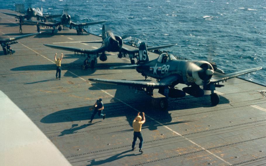 U.S. Marine Corps Vought F4U-4 Corsairs of Marine Fighter Squadron VMF-323 armed with bombs, napalm tanks and HVAR rockets are launched for a mission from the flight deck of the escort carrier USS Sicily (CVE-118) off Korea, in 1951. Note the rattlesnakes painted on some aircraft, due to the squadron’s nickname “Death Rattlers.”