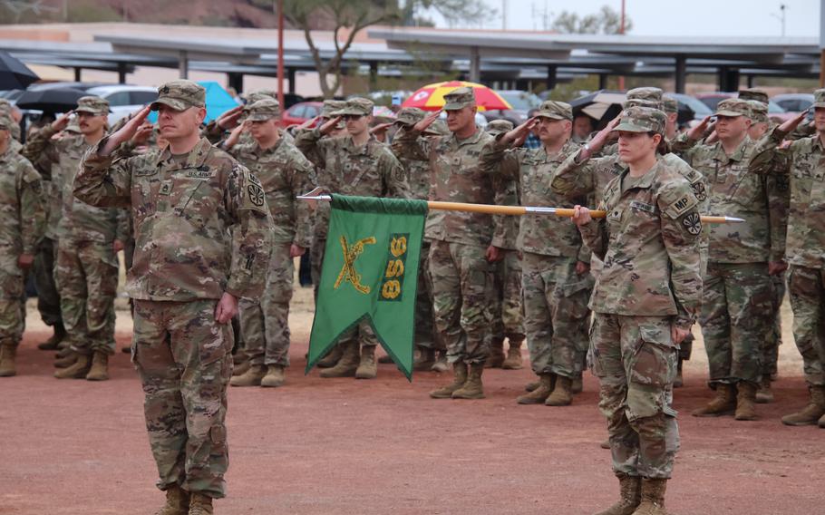 More than 150 service members of the 856th Military Police Company from the Arizona Army National Guard rally together with their families on Bushmaster Field in Phoenix, Ariz., for an send-off ceremony Sunday, Jan. 21, 2024. 