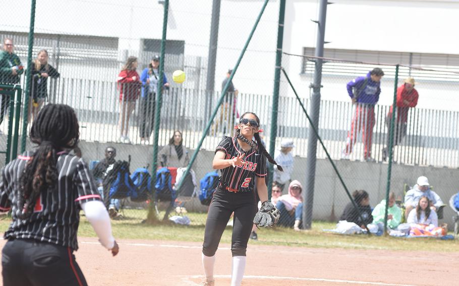 Kaiserslautern pitcher Amanda Garcia tosses the ball to Raiders first baseman Laylah Cole on Friday, May 23, 2025, during the DODEA-Europe Division I softball championsihps at Kaiserslautern, Germany.