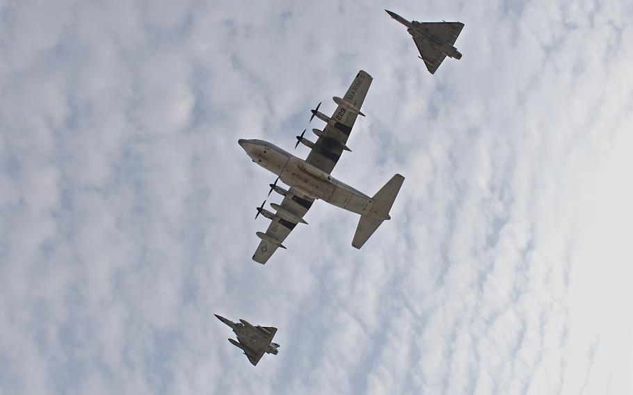 A U.S. KC-130J Super Hercules, with Combined Joint Task Force — Horn of Africa, and two French Dassault Mirage 2000s perform a combined flyover with during a Patriot’s Day ceremony at Camp Lemonnier, Djibouti, Sept. 11, 2021, commemorating the 20th anniversary of 9/11.