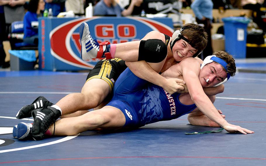 Stuttgart's Jack Gruver locks in Ramstein's Jace Monson during a 190-pound match on Saturday at Ramstein High School at Ramstein Air Base, Germany.
