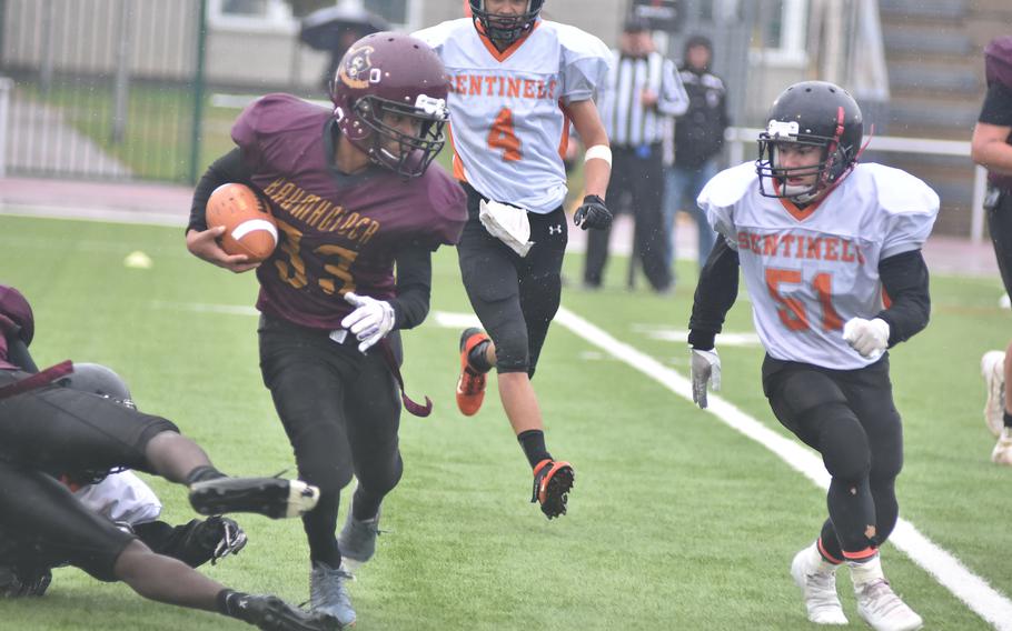 Baumholder's Camron McDonald was named defensive MVP but also did his share of damage on offense, despite the best efforts of Spangdahlem's Brenden Castillo, who tries to make the tackle on this play in the DODEA-Europe Division III title game at Kaiserslautern, Germany, on Oct. 30, 2021.