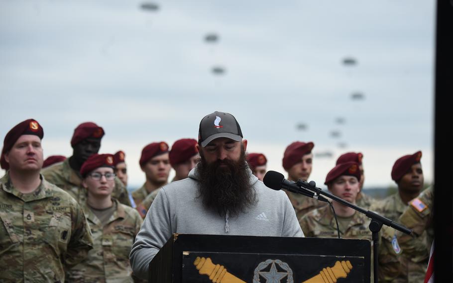 Former platoon member Luke Spencer reminisces on his time in Afghanistan with Cpl. Emmanuel Hernandez during a drop zone dedication ceremony in Hernandez's honor at Grafenwoehr, Germany, on April 20, 2023.