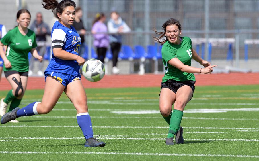 Alconbury’s Lorna Lee takes a shot past Sigonella’s Marley McElree in the girls Division III finals at the DODEA-Europe soccer finals in Ramstein, Germany, May 18, 2023. Sigonella took the title with a 4-2 win.